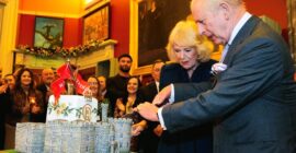 HAPPY BIRTHDAY KING CHARLES!  (PHOTO – KING CHARLES CUTS HIS WINDSOR CASTLE SHAPED BIRTHDAY CAKE ALONGSIDE QUEEN CAMILLA)