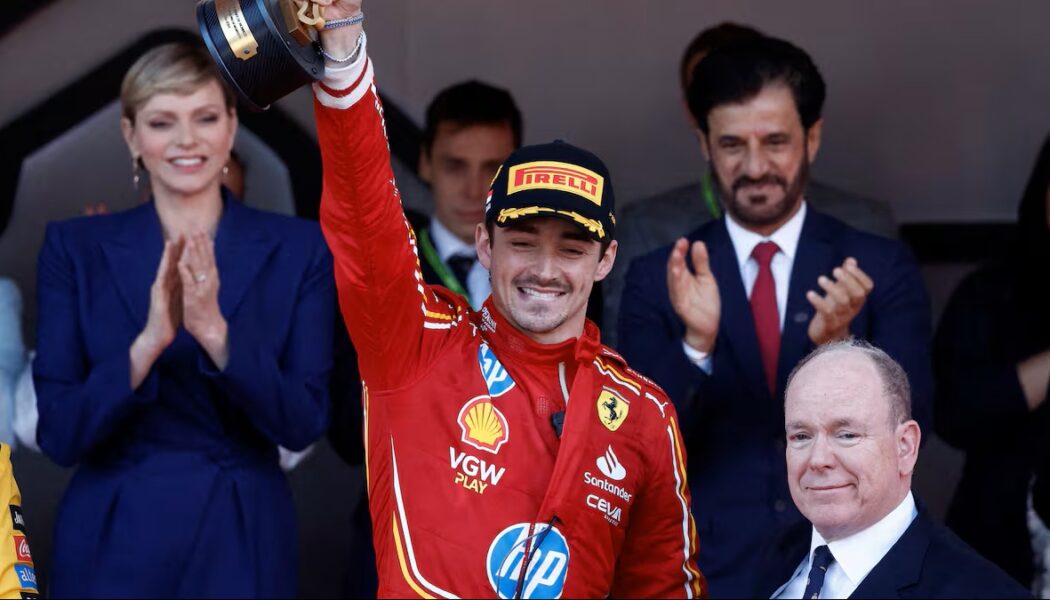 Charles Leclerc Wins The Monaco Grand Prix 2024  (Photo – Charles Leclerc Celebrates On The Podium With Princess Charlene and Prince Albert)