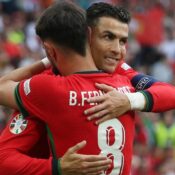 EUROS 2024 – 22/06/2024  (PHOTO – RONALDO CONGRATULATES FERNANDES AFTER SCORING FROM HIS ASSIST)