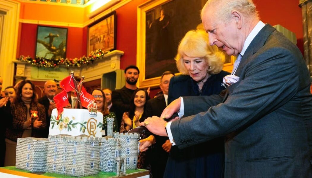 HAPPY BIRTHDAY KING CHARLES!  (PHOTO – KING CHARLES CUTS HIS WINDSOR CASTLE SHAPED BIRTHDAY CAKE ALONGSIDE QUEEN CAMILLA)