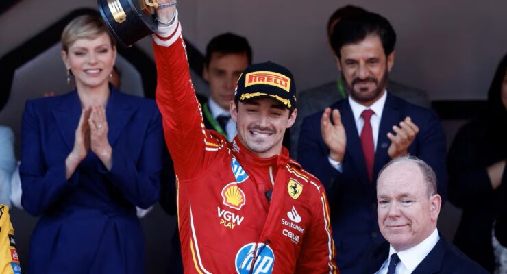 Charles Leclerc Wins The Monaco Grand Prix 2024  (Photo – Charles Leclerc Celebrates On The Podium With Princess Charlene and Prince Albert)